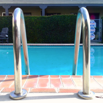 The classic chrome pool ladder at a swimming pool